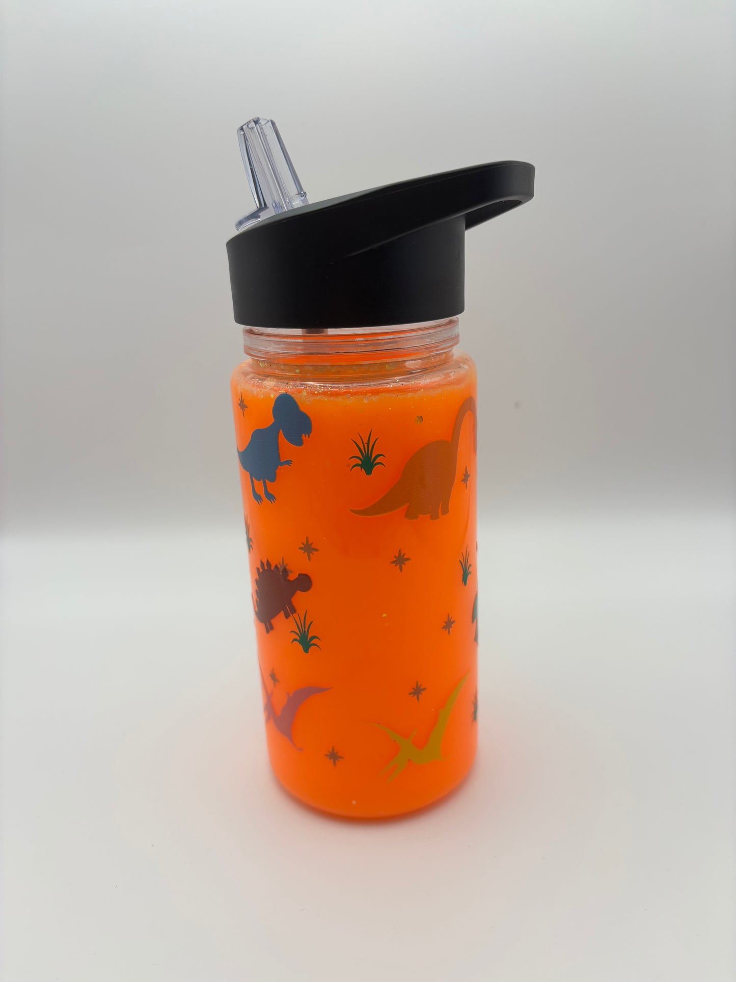Dinosaurs are invading with this glowing the dark kids cup with flip up scraw